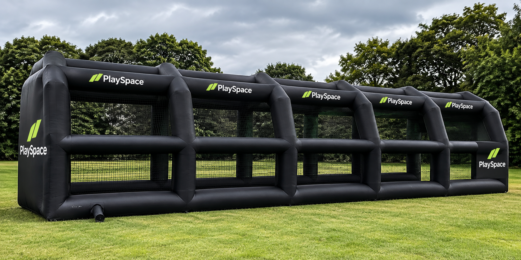 Wide inflatable PlaySpace pop-up sports structure set up outdoors on grass